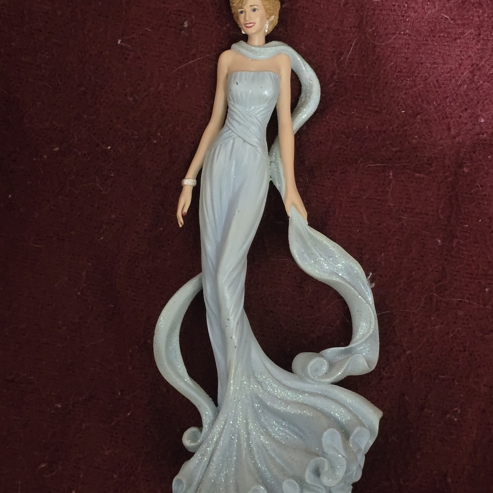 Elegant Blue Flowing Gown Figurine